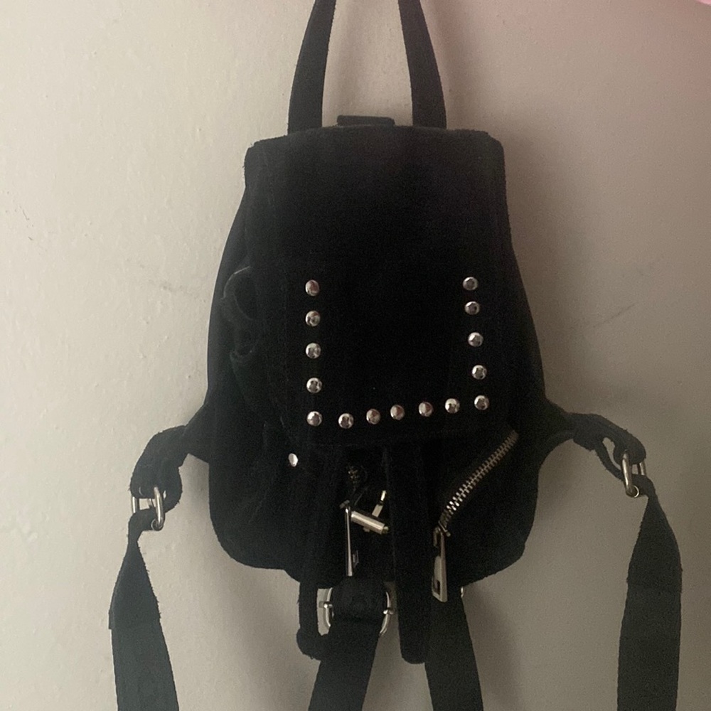 Small black suede back pack . Really cute